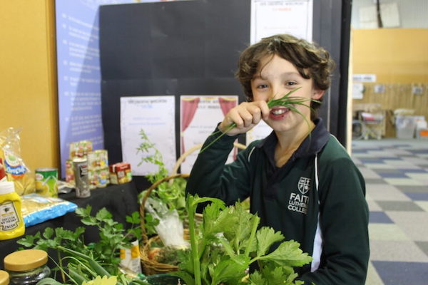 Student playing with herbs