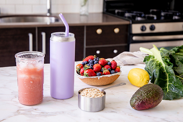 Smoothie ingredients lined up on a kitchen benchtop